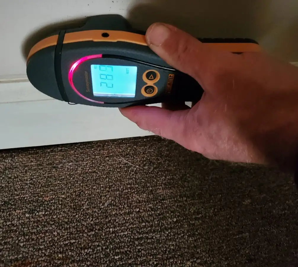 Moisture detection at baseboard during Burst Pipe Cleanup in Del City